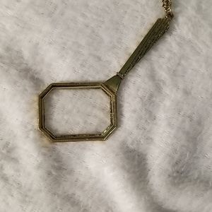 Gold magnifying glass necklace